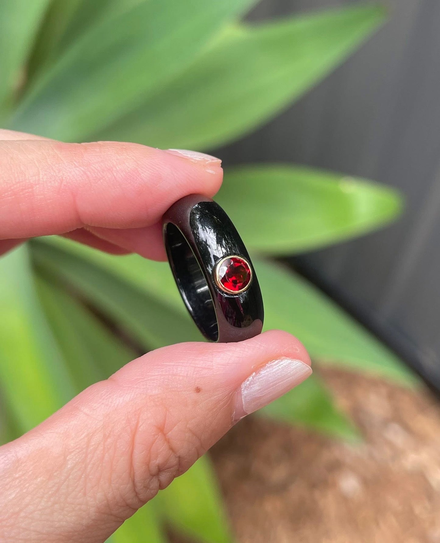 Natural black jade ring with earthy red garnet in 9ct yellow gold