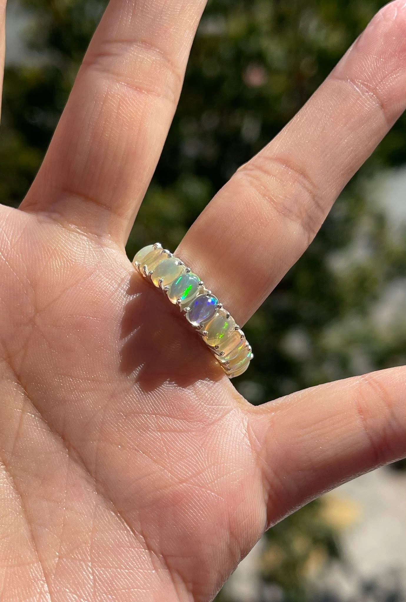 Natural solid opal eternity band set in sterling silver