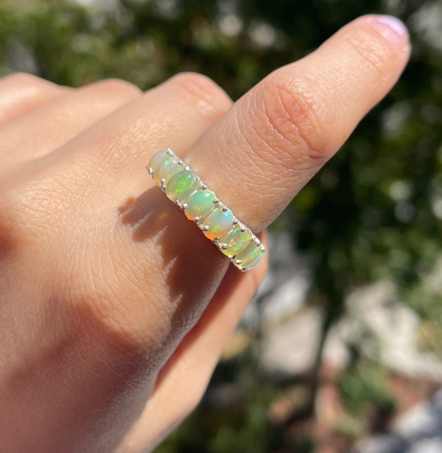 Natural solid opal eternity band set in sterling silver