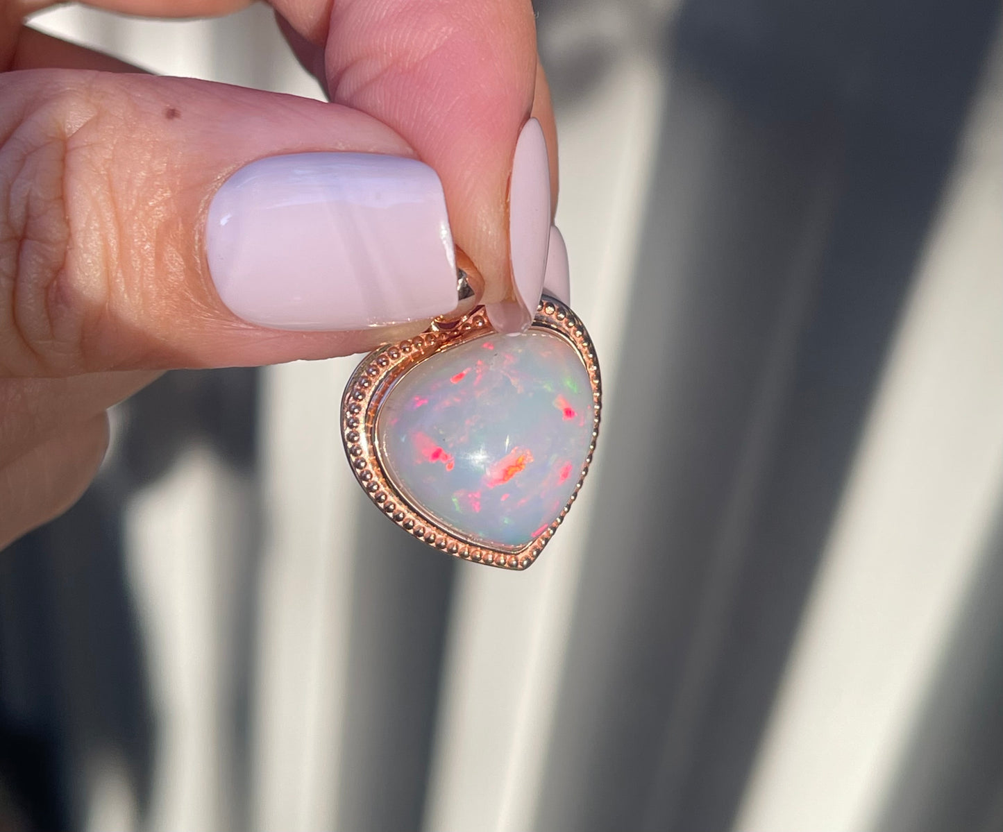 7.1ct Opal Pendant In 9ct Rose Gold milgrain frame