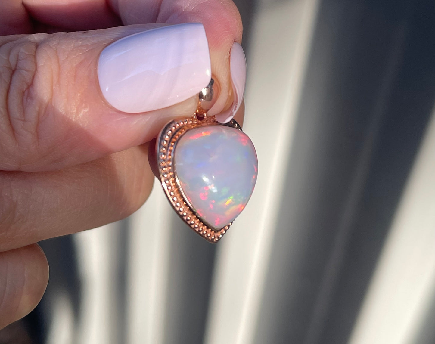 7.1ct Opal Pendant In 9ct Rose Gold milgrain frame