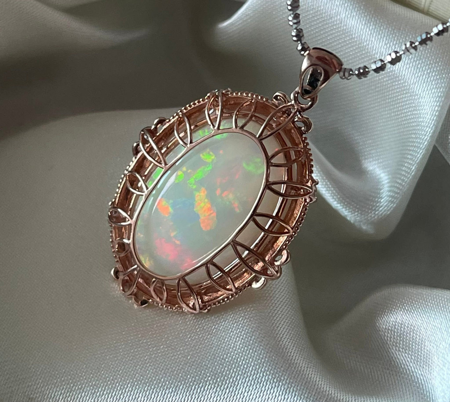 Bespoke 9ct rose gold 16ct natural opal pendant with diamonds