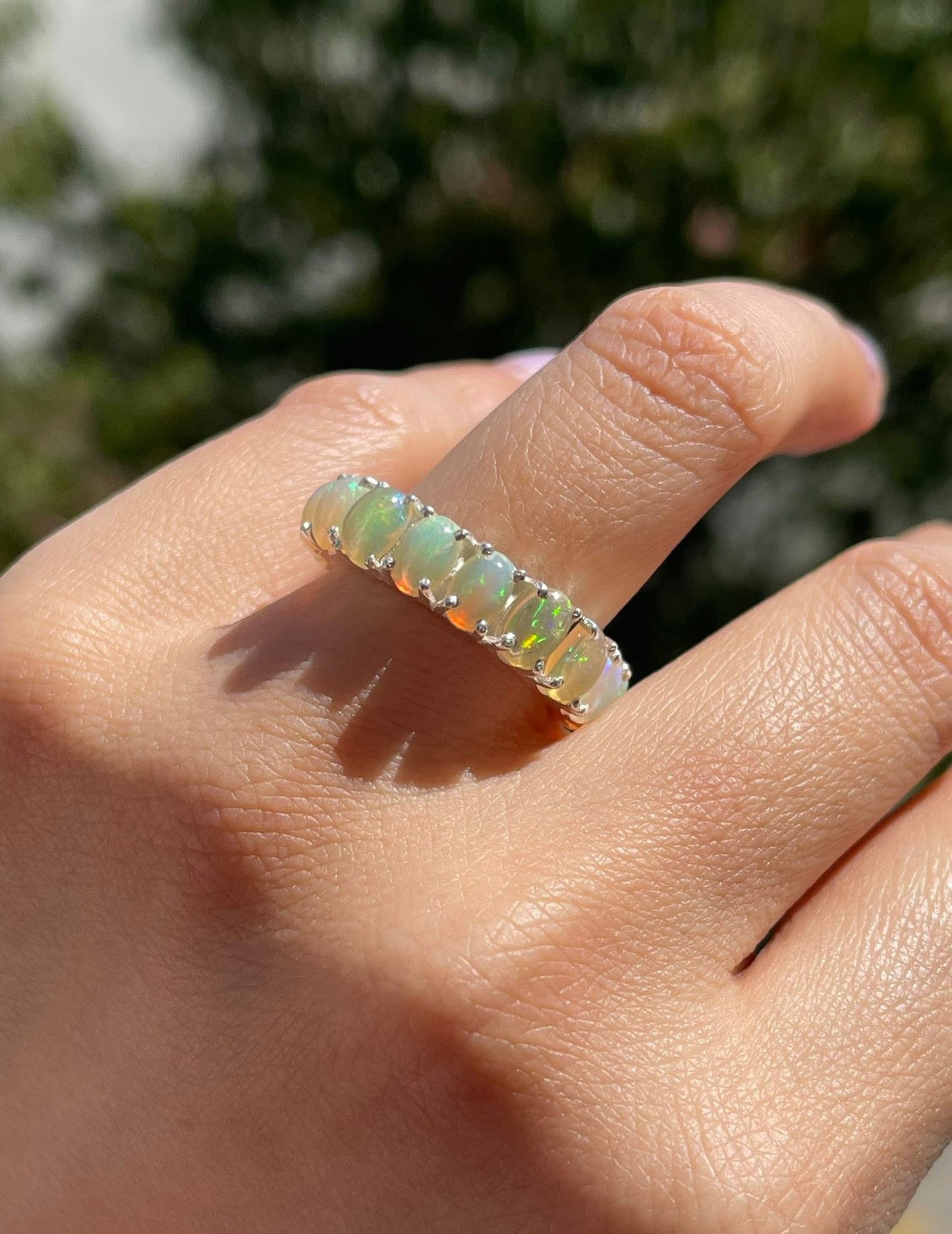 Natural solid opal eternity band set in sterling silver