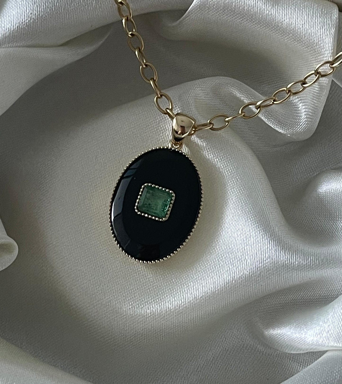 Art deco style 9ct yellow gold onyx pendant with natural emerald
