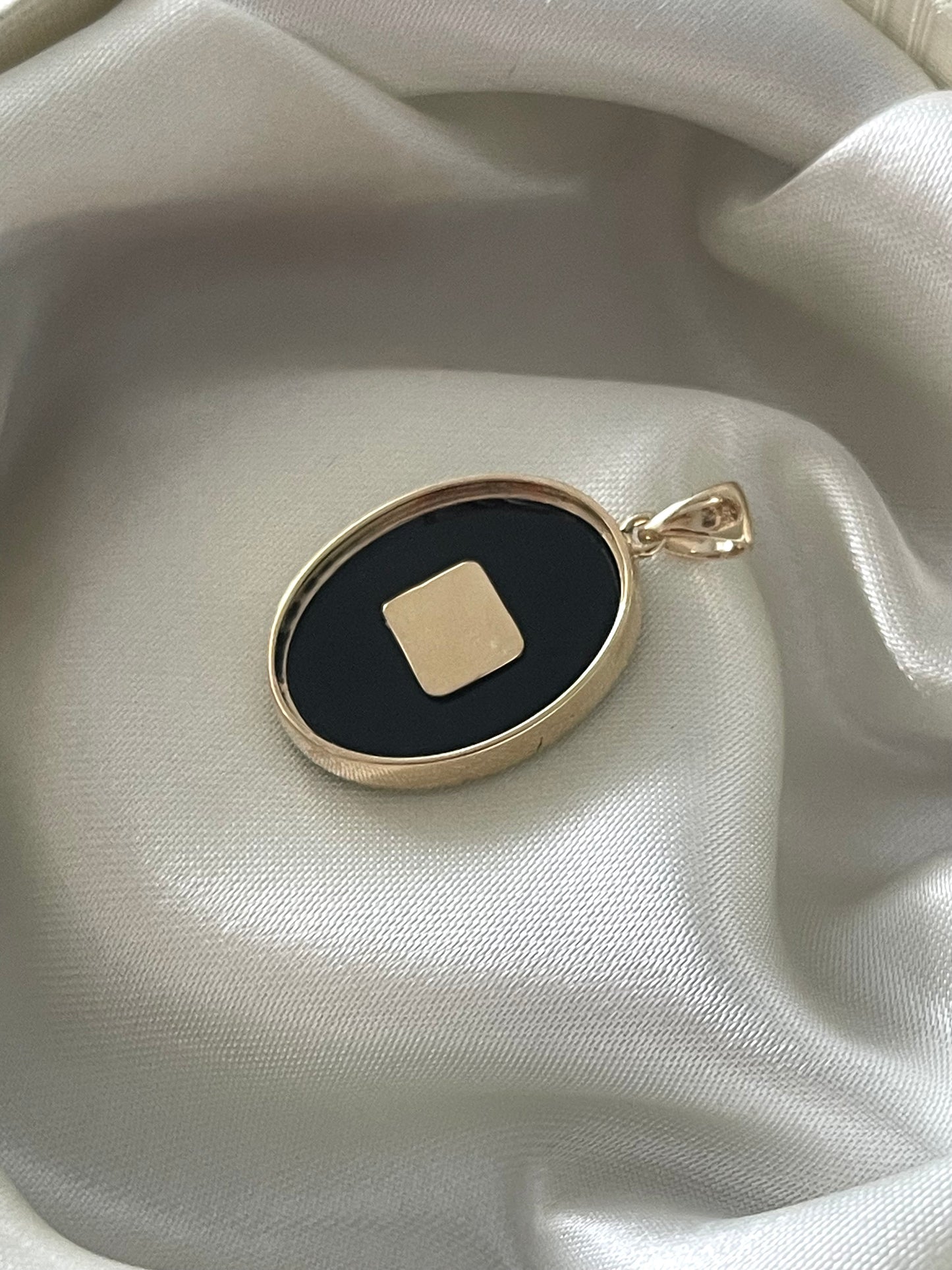 Art deco style 9ct yellow gold onyx pendant with natural emerald