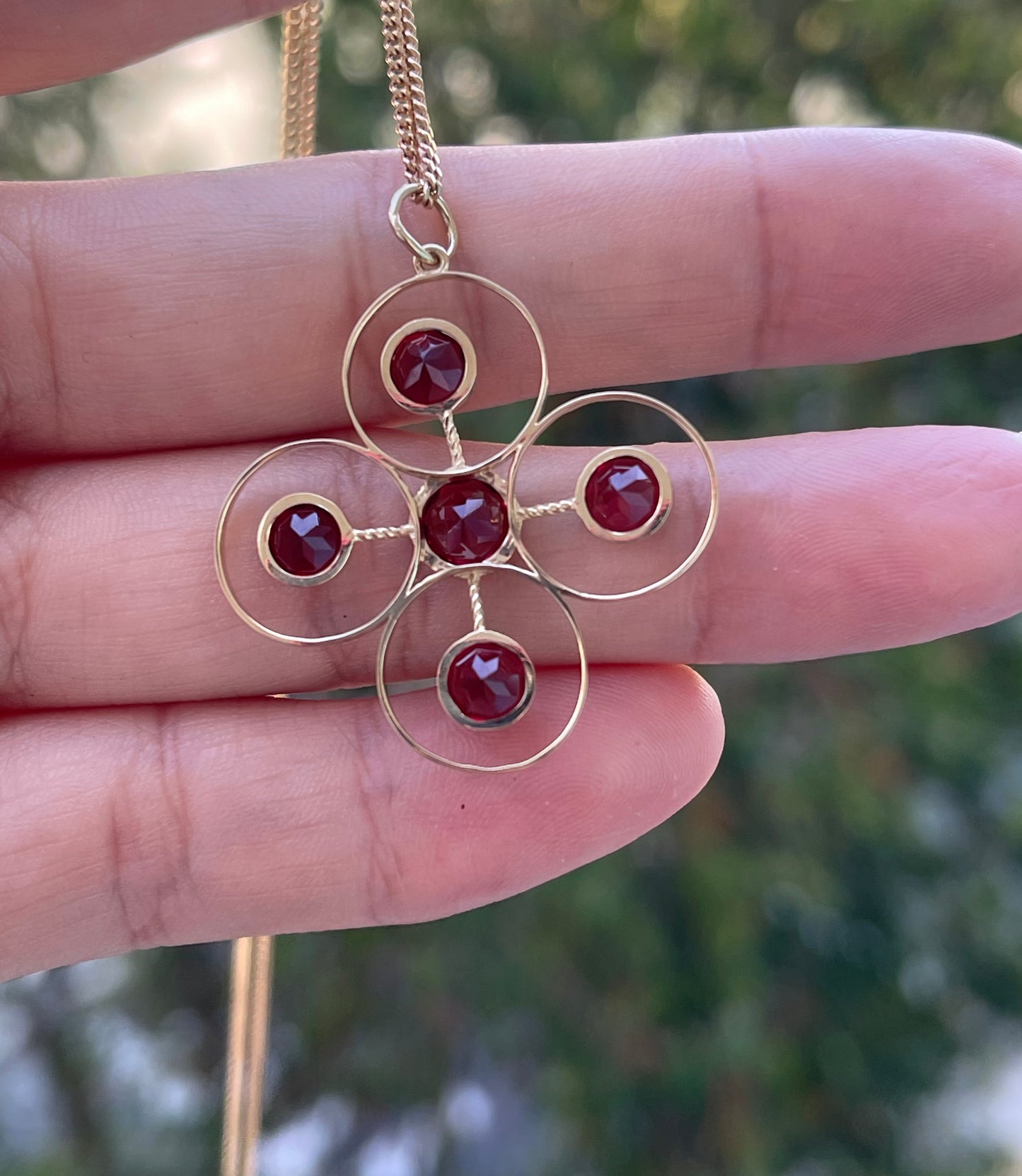 Statement 9ct yellow gold natural garnet pendant