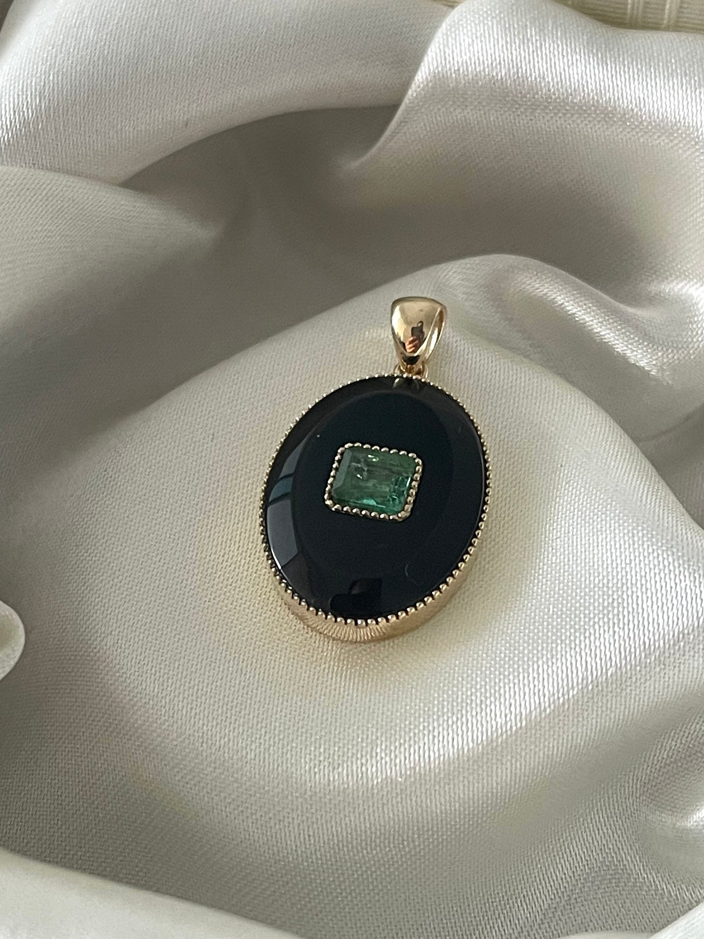 Art deco style 9ct yellow gold onyx pendant with natural emerald