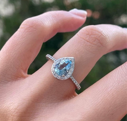 Modern 10ct white gold pear shape aquamarine diamond halo ring