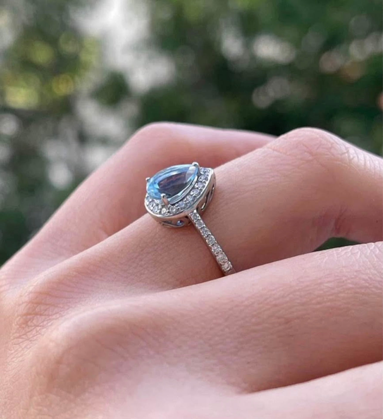 Modern 10ct white gold pear shape aquamarine diamond halo ring