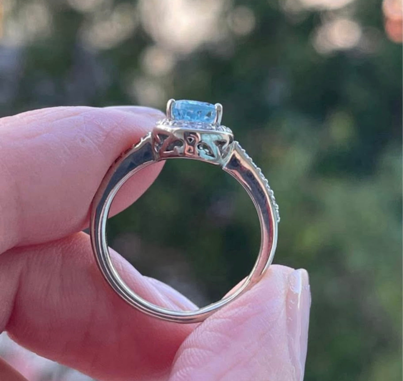 Modern 10ct white gold pear shape aquamarine diamond halo ring