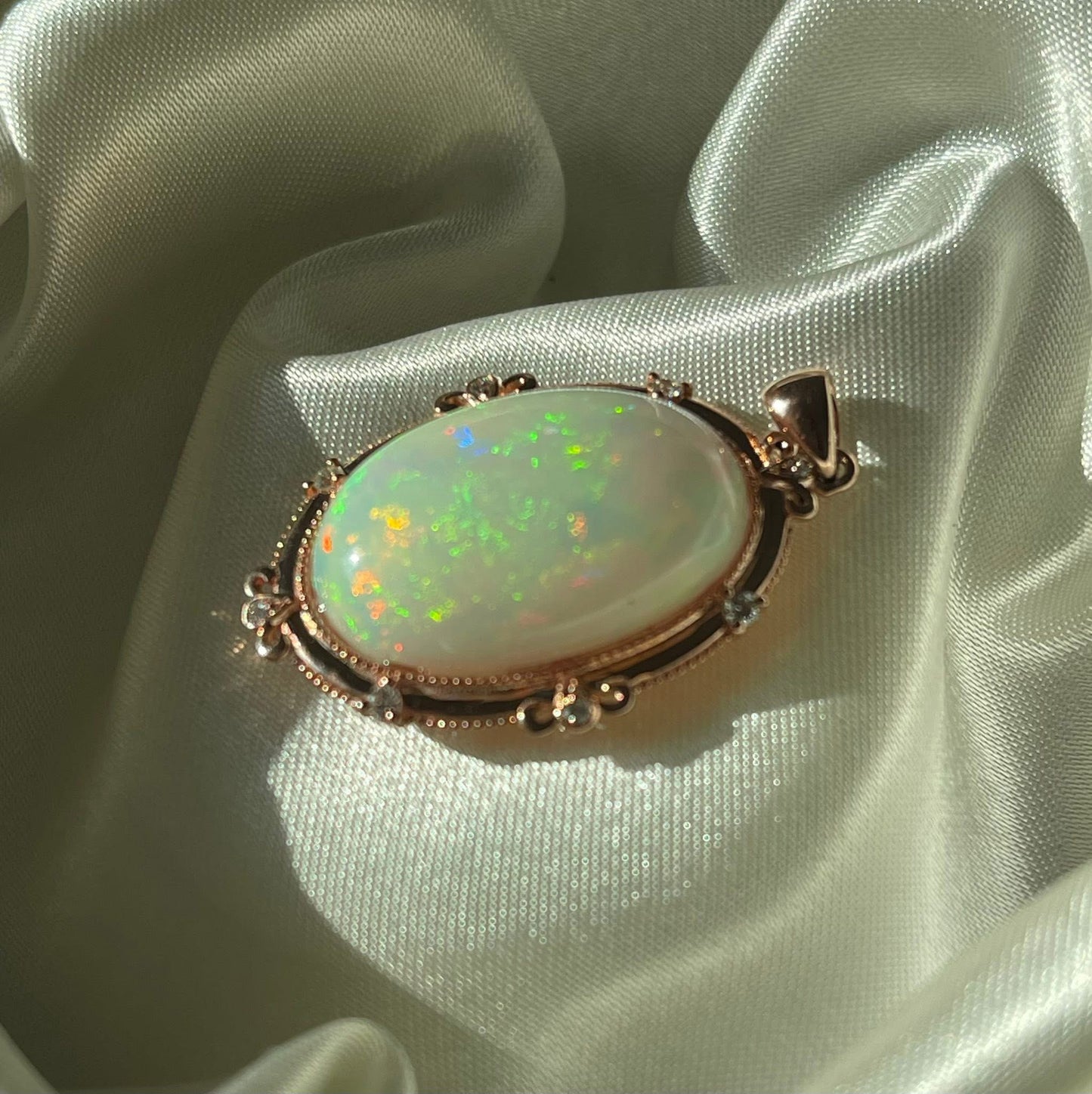 Bespoke 9ct rose gold 16ct natural opal pendant with diamonds