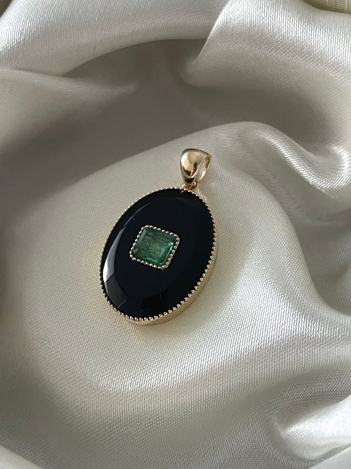 Art deco style 9ct yellow gold onyx pendant with natural emerald