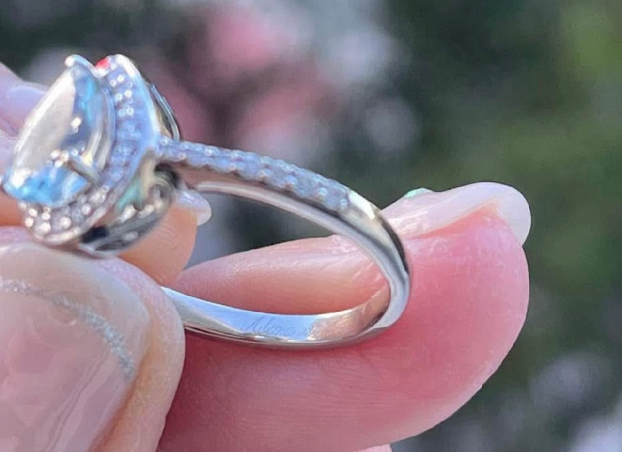 Modern 10ct white gold pear shape aquamarine diamond halo ring