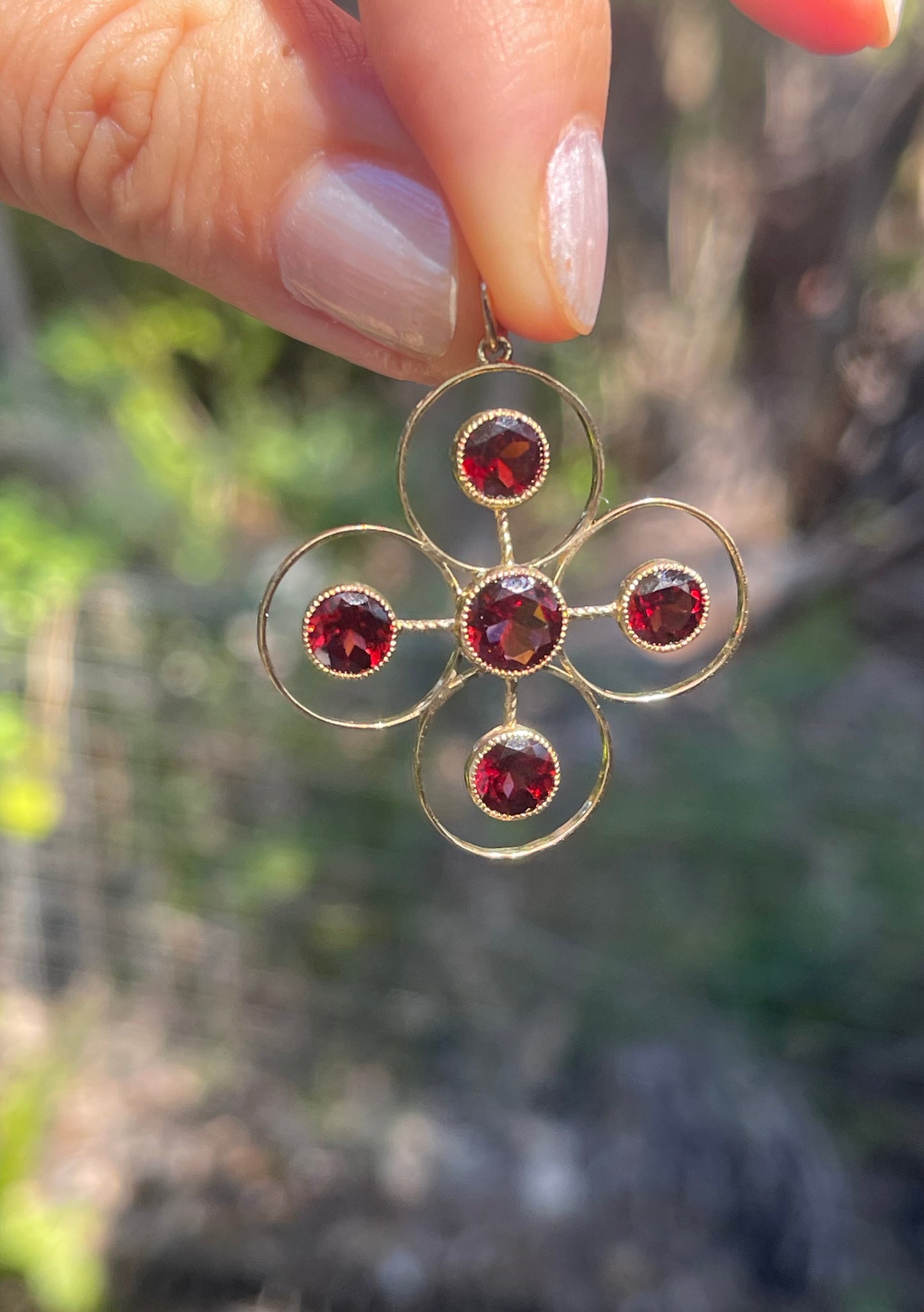 Statement 9ct yellow gold natural garnet pendant