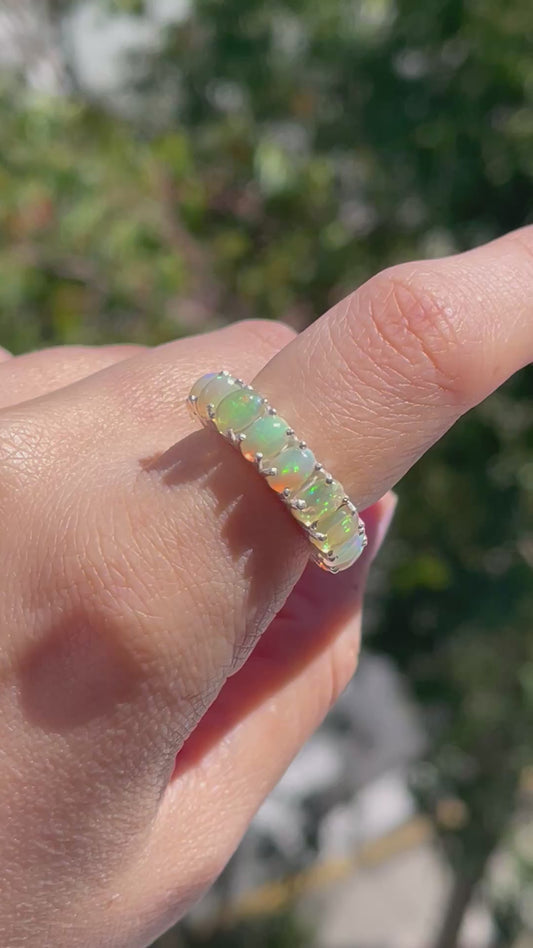 Natural solid opal eternity band set in sterling silver
